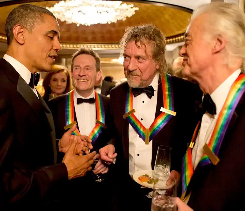 President Barack Obama speaking with Led Zeppelin members John Paul Jones, Robert Plant, and Jimmy Page.