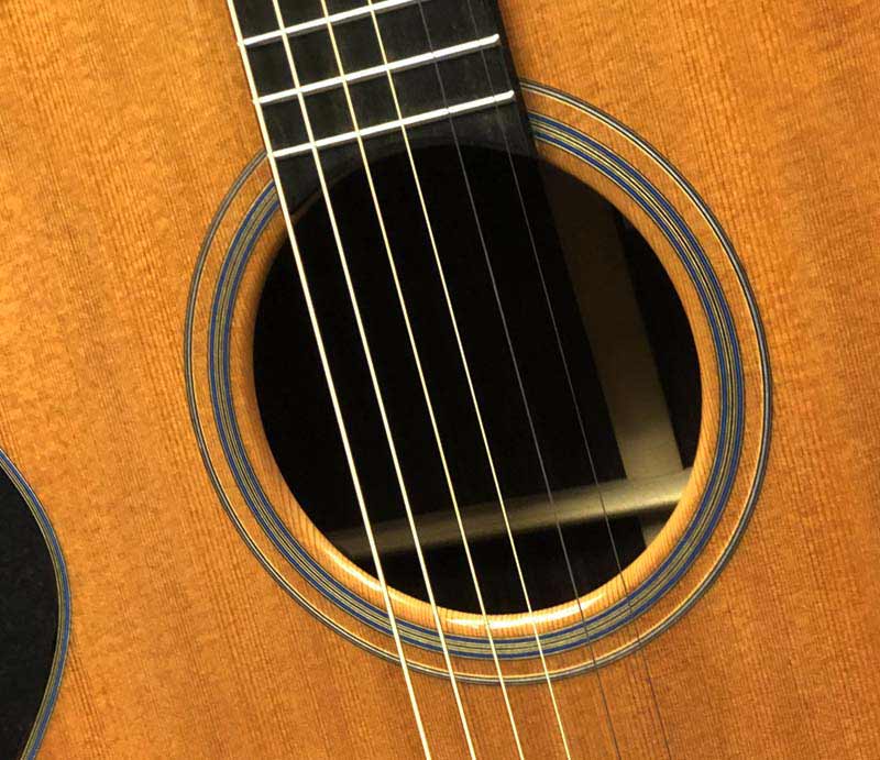 Close up of sound hole with rosette.