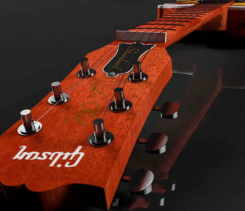 A close-up perspective view of a mahogany Gibson Les Paul Standard headstock showing the inlaid Gibson logo, Les Paul script, tuning pegs, and truss rod cover over a dark background.